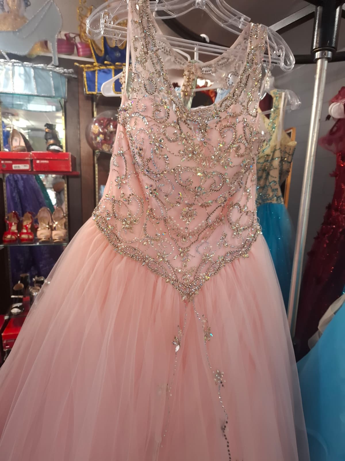 Pink quinceañera dress with beading and a tulle skirt